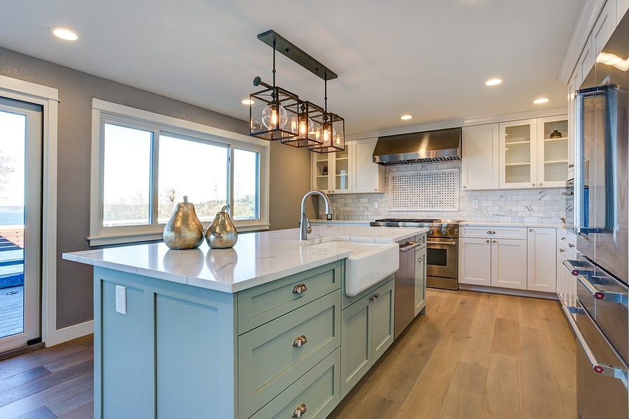 Beautiful Kitchen Room With Green Island And Farm Sink.